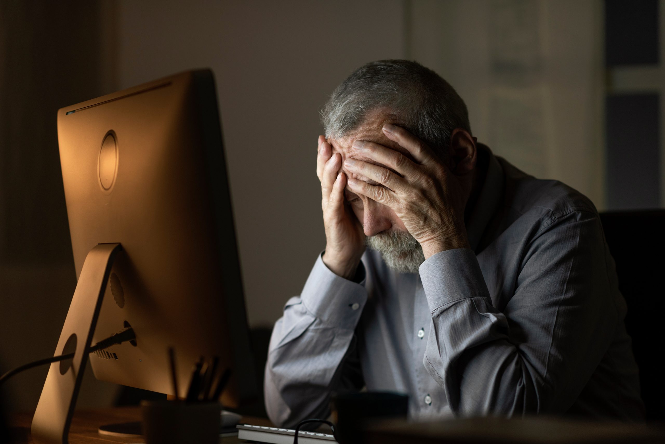 Lonely sad senior man connecting at night Disoriented elder experiencing delirium